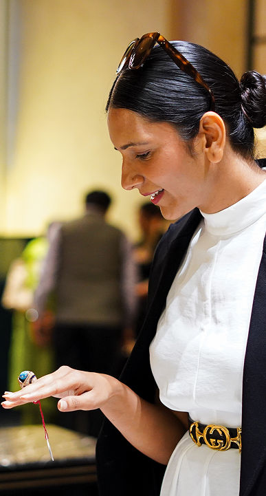 A true jewellery connoisseur trying on one of the rare pieces at the flagship store.